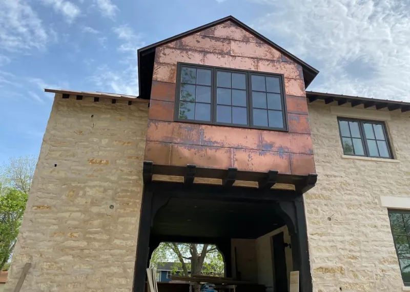 Copper metal panel facade on a stone building for Metal Roof Coating in Germantown